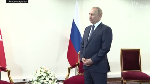 Russian President, Vladimir Putin, was left awkwardly standing in a room in front of reporters while