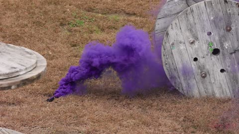 Tactical Purple Smoke Grenade Deployed in Paintball Match