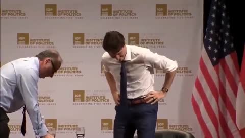 Justin Trudeau flailing his arms around during a speech