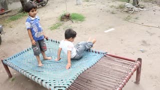 While dancing on bed kid fell inside and keep smilling