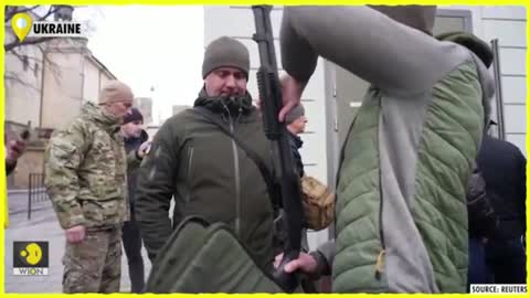 Watch: Ukrainians line up outside gun shops to defend against Russian invasion