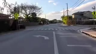 A Man drives a Motorbike from one end of burnt down Lahaina to the other