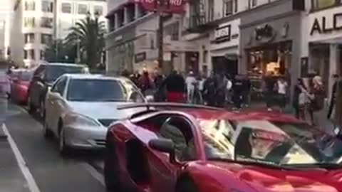 Guy jumps On A Lamborghini Aventador Twice And Gets Delt With!
