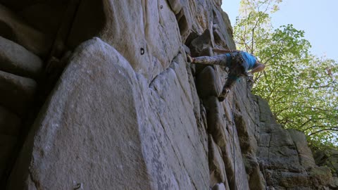 Low Angle View of a Woman Rock Climbing