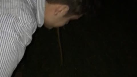 Guy grey shirt throwing up outside