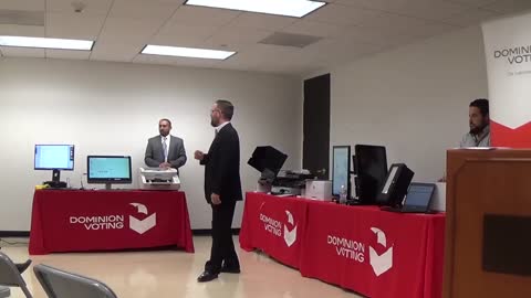 DOMINION EXECS AT VOTING EQUIPMENT EXPO EXPLAIN THEIR SYSTEM