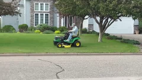 Neighbor Mows With Facemask