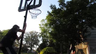 Hit in head with basketball when fixing net