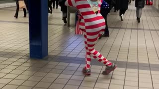 Man with donald trump mask american flag outfit dancing