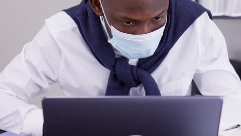 Man Wearing Face Mask While Working