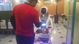 Robot Waitress Designed To Look Like Its Wearing A Hijab