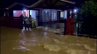 Chilean residents evacuate flooded homes