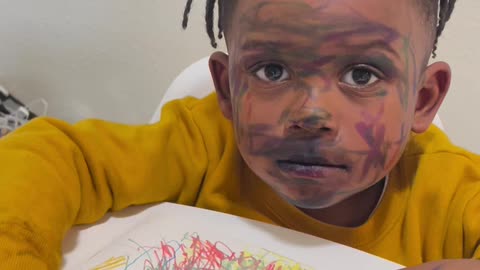 Child with Marker on His Face Plays Innocent