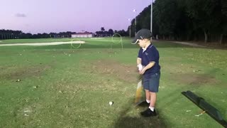 Little Golfer Hits Ball Through A Hoop Claims He Hit A Hole In One