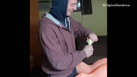 Guy drinks alcohol out of blow up doll's butt