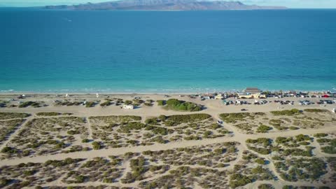 Coast of a sunny beach from above