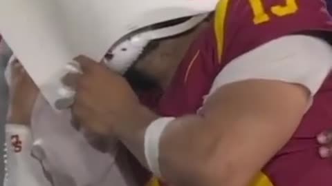 USC QB Caleb Williams crying on the sidelines after losing to Washington