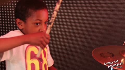 7 year old highly talented drummer jams with reggae band!