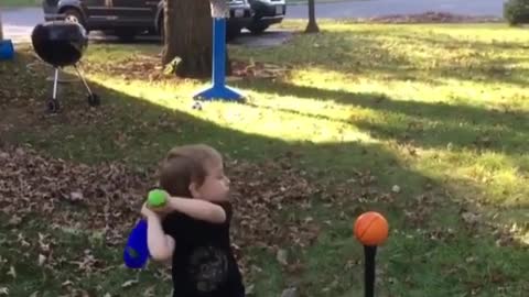 4 year little old boy put a ball into the basket. unbelivable