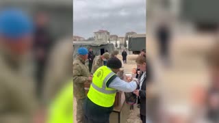 Soldiers Distribute Hot Meals Among Victims