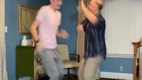 father and son dancing