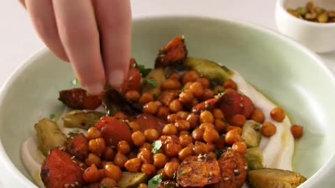 "Sensational Flavors Unite: Heavenly Sweet & Spicy Roasted Veggies on a Bed of Creamy White Bean Spread"