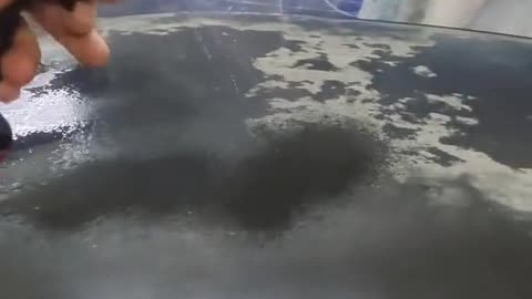 Cleaning of stains on the surface of automobile sheet metal