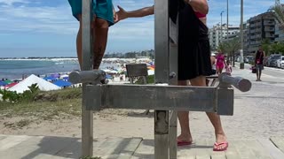 Woman Interrupts Guy's Beach Workout