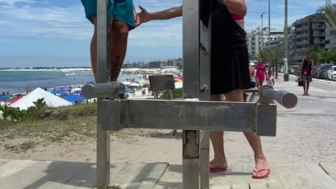 Woman Interrupts Guy's Beach Workout