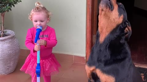 Toddler and Pet Dog Sing Together Loudly