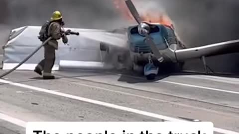 Plane crash-lands onto a California freeway, hits a truck, and erupts in flames