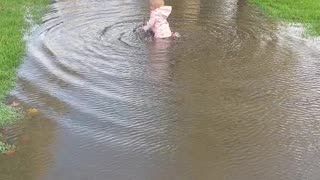 Daughter Gives Dad a Hard Time at Puddle