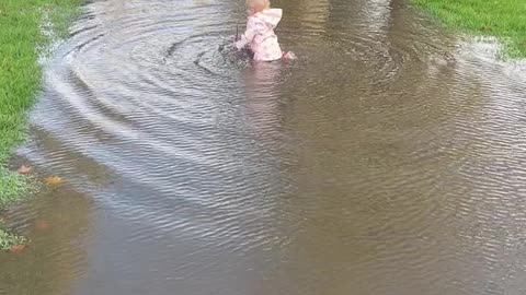 Daughter Gives Dad a Hard Time at Puddle
