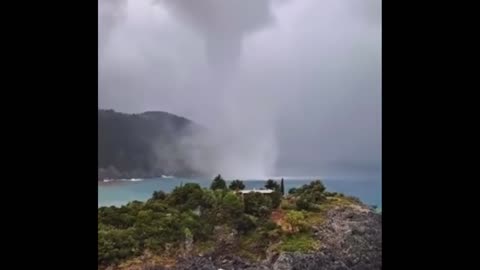 A waterspout swept past the island of Euboea in Greece.