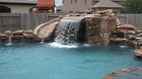 Free Form Swimming Pools with rock Waterfalls