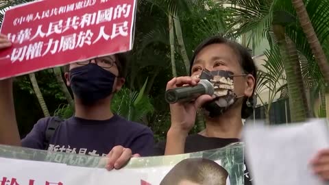 HK activists stage small march on China National Day