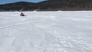 Kid does Snowmachine Stunt, Alaska