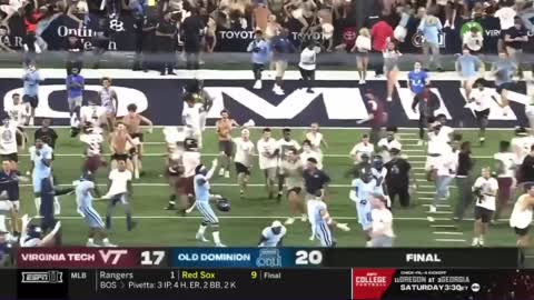 Old Dominion fan gets trucked by Virginia Tech player while storming field