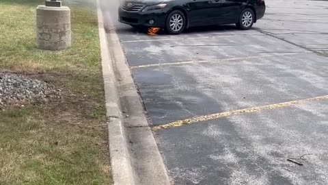Firefighters Put Out Car Fire