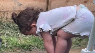 Toddler Sticks Her Head Mud Puddle