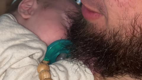 Baby Keeps Painfully Tight Hold on Dad