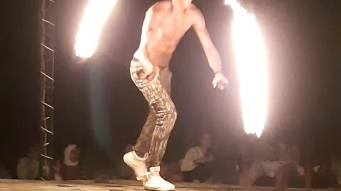 Guy bouncing with 2 fire wires