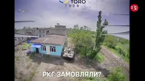 Kamikaze drone targets armored personnel carrier hidden by Russians in residential area