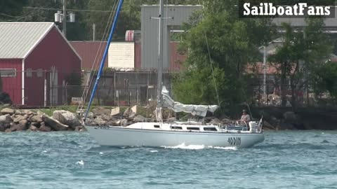 ODIN Sailboat Cruising Down St Clair River In Great Lakes