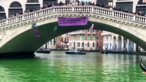 Climate change protesters turn Venice canal green