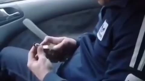 Ukrainian man accidentally pulls pin while inside a car.