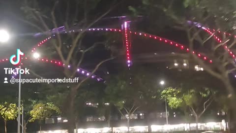 Driving Past OCBC Aquatic Centre in Singapore at Night