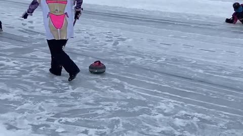 Curling Player Takes Hard Fall on Ice