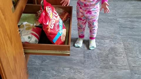 Little Girl gets caught sneaking Chips