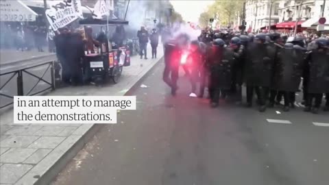 Protesters set fire to restaurant favou red by Macron and clash with police in Paris